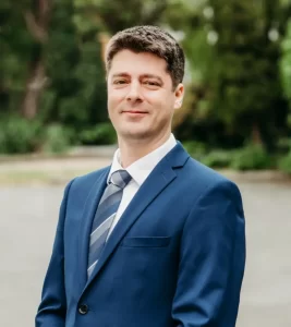 Man in blue suit outdoors portrait